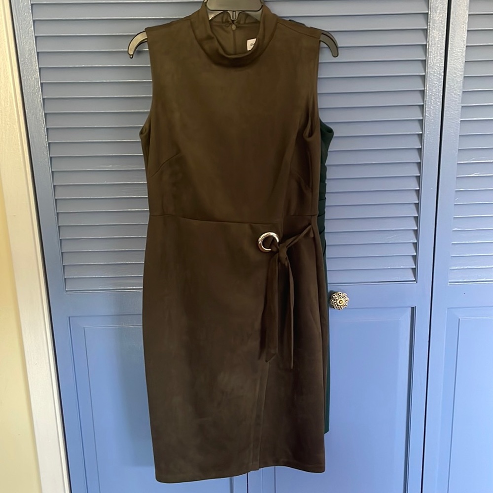 New olive color dress very forgiving in mid section. 41” long new like.